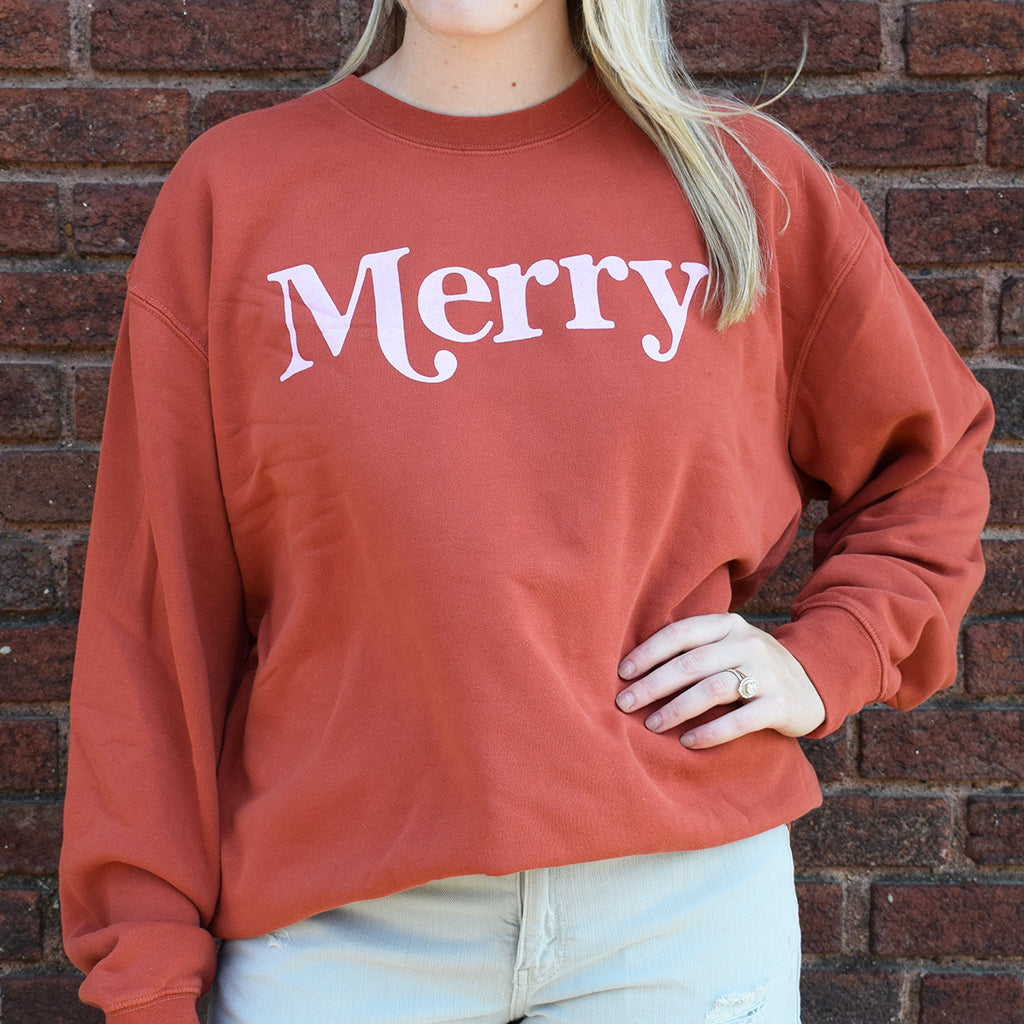 image of red sweatshirt that says Merry